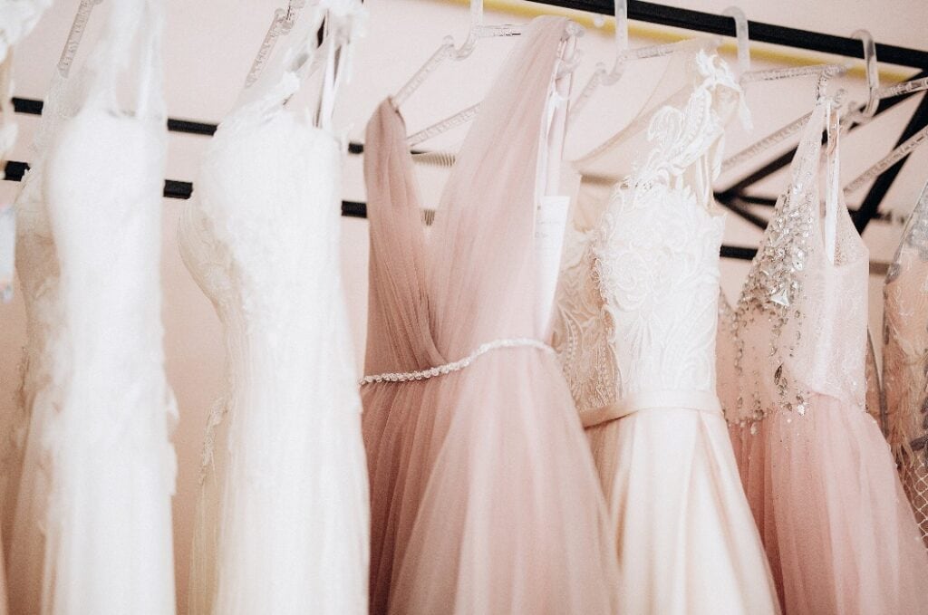 details of a wedding dress hanging on a hanger