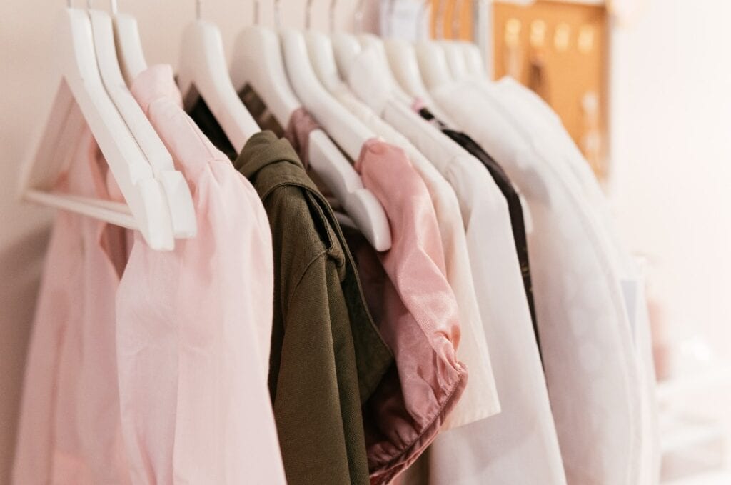 Women cloths on hangers in a row.